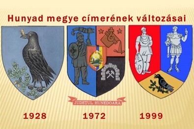 Hunyad megyének a Hunyadiaktól örökölt hollós címerét 1928-ban még megtartották, 1972-ben már dák harcossal helyettesítették, 1999-ben a harmadik mezőbe szorították, fölé helyezték Decebal dák király és Traianus római császár alakját